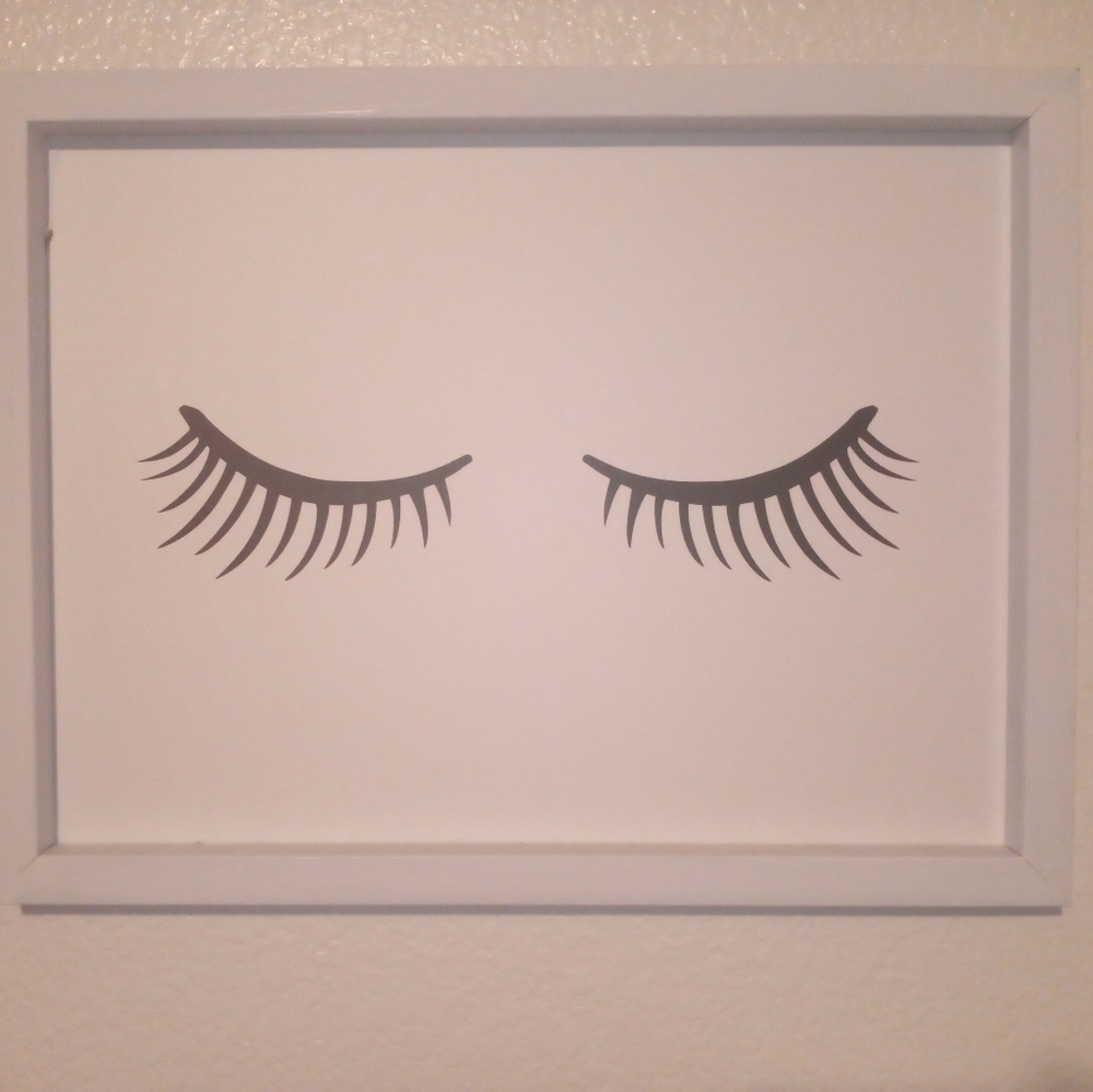 A white pic with eyelashes